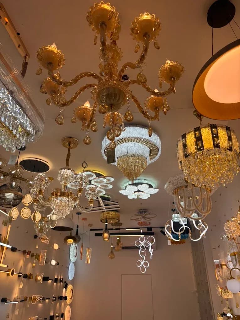 Crystal chandeliers hung across the showroom ceiling