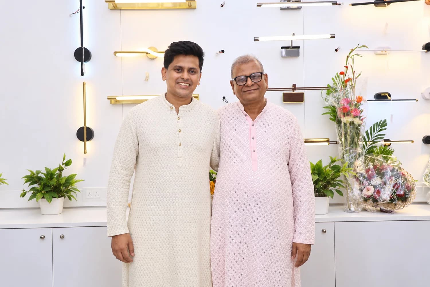The father and son who run Jay Laxmi Light House, in the showroom
